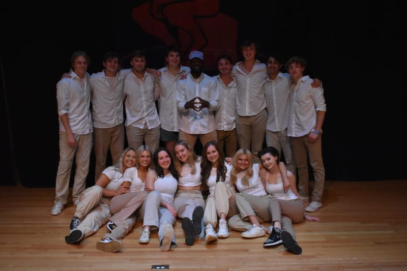 The Lilting Banshees troupe posing together on stage